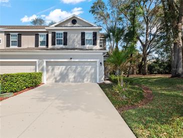 Charming two-story home with a two-car garage and well-maintained landscaping at 2056 Switch Grass Cir, Ocoee, FL 34761