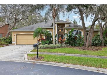 Charming single-story home with well-manicured lawn and mature landscaping showcasing curb appeal at 2958 Willow Bay Ter, Casselberry, FL 32707