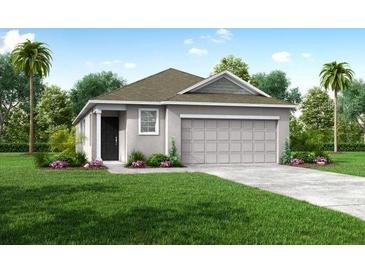 Charming one-story home with well-manicured lawn and attached two-car garage at 3864 Bluethread Way, Poinciana, FL 34759