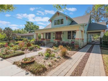 Charming two-story home with a landscaped yard and inviting front porch at 1612 E Washington St, Orlando, FL 32803