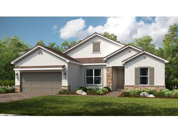 Charming single-story home with stone accents, a two-car garage, and a well-manicured front lawn at 5647 Nevis Ter, Kissimmee, FL 34758
