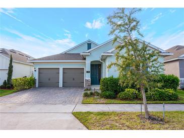 Charming one-story home featuring a two-car garage, beautiful landscaping, and a welcoming entrance at 706 Hyperion Dr, Debary, FL 32713