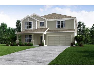 Charming two-story home with neutral colors, manicured lawn, and a two-car garage at 3222 Viceroy Ct, Kissimmee, FL 34759