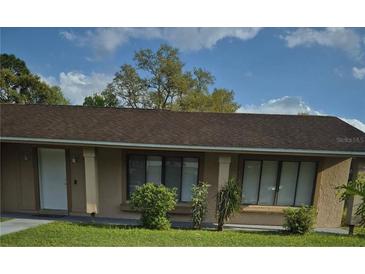 Charming single-story home with a well-maintained lawn and a welcoming front entrance at 406 Score Ln, Kissimmee, FL 34759