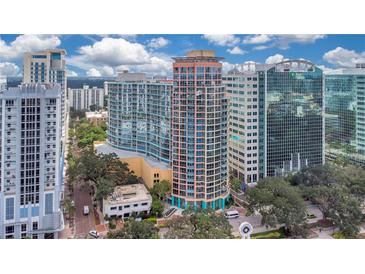 High-rise condo building featuring contemporary architecture and floor-to-ceiling windows at 322 E Central Blvd # 1910, Orlando, FL 32801