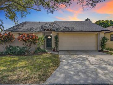 Charming single-story home with a well-maintained lawn and a two-car garage, offering curb appeal at 734 Adidas Rd, Winter Springs, FL 32708