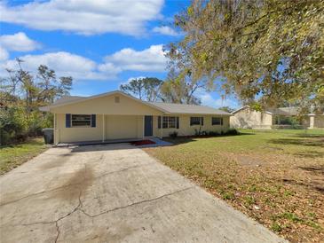 Charming single-story home featuring blue shutters and a well-maintained front yard at 4112 Grove Pl, Lakeland, FL 33810
