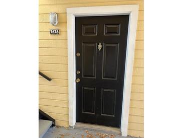 Inviting front door with white trim and visible unit number at 1013 S Hiawassee Rd # 3626, Orlando, FL 32835