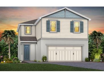 Charming two-story home with a two car garage, neutral siding, and beautiful sunset at 2725 Serenity Garden Dr, Kissimmee, FL 34744