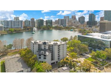 Stunning aerial view of the building and its downtown Orlando lakefront setting at 401 E Robinson St # 202, Orlando, FL 32801