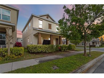 Charming two-story home featuring a covered front porch and landscaped yard at 8255 Bryce Canyon Ave, Windermere, FL 34786