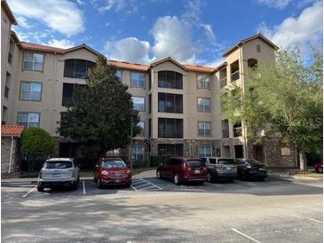 Apartment complex features well-maintained landscaping and convenient parking at 1361 Tuscan Ter # 7105, Davenport, FL 33896