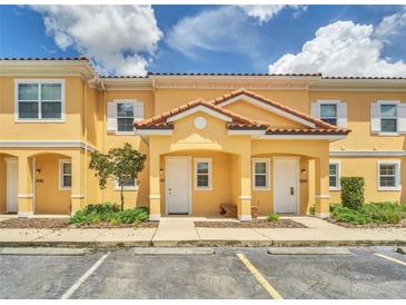 Charming townhome with a private entrance, tile roof, and well-maintained landscaping at 2647 Corvette Ln, Kissimmee, FL 34746