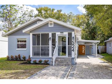 Charming single-Gathering home with a screened front porch, covered parking, and lovely landscaping at 524 W Winter Park St, Orlando, FL 32804