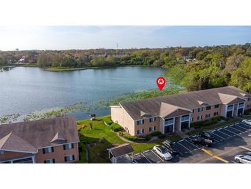 Beautiful lakefront condos feature lush landscaping and convenient parking spaces at 145 N Pearl Lake Cswy # 104, Altamonte Springs, FL 32714