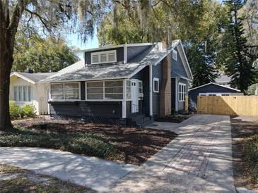 Charming two-story home with brick chimney, well-manicured lawn, and inviting curb appeal at 16 N Lawsona Blvd, Orlando, FL 32801