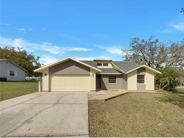Charming single-story home featuring a two-car garage and well-maintained front yard at 3646 Dovetail S Ln, Lakeland, FL 33812