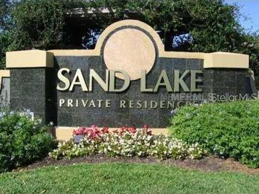 Attractive Sand Lake Private Residences sign with manicured landscaping at 8837 Latrec Ave # 5307, Orlando, FL 32819
