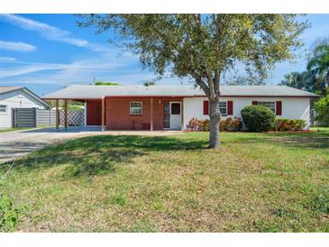 Charming single-story home with red brick accents and mature landscaping at 1109 Denton Rd, Winter Park, FL 32792