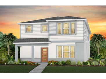 New two-story home featuring craftsman style, front porch and landscaped garden at 7094 Rosy Sky Ave, Orlando, FL 32829