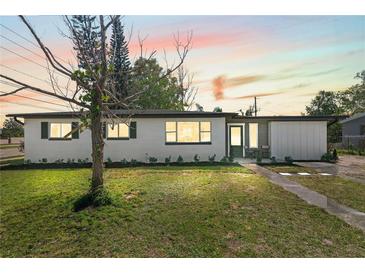 Charming single-story home featuring a well-maintained lawn and inviting curb appeal at 7416 Kadel Way, Orlando, FL 32822