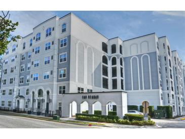 Modern condo building exterior with manicured landscaping and a welcoming arched entrance at 206 E South St # 1018, Orlando, FL 32801