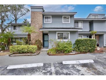 Charming townhouse with well-maintained landscaping and brick architectural details at 713 Saint Matthew Cir, Altamonte Springs, FL 32714