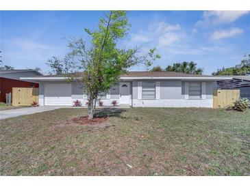 Charming single-story home featuring a well-maintained lawn and a welcoming front entrance at 8960 Se 88Th Pl, Ocala, FL 34472