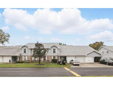 Charming townhomes feature well-manicured lawns and ample parking space at 5336 White Cliff Ln # 6, Orlando, FL 32812