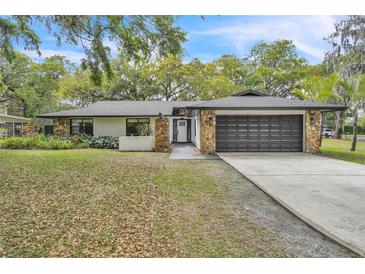 Charming single Gathering home with a two car garage and stone accents at 5374 Crooked Oak Cir, St Cloud, FL 34771