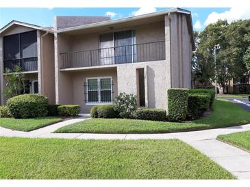 Well-maintained condo featuring manicured landscaping and inviting curb appeal at 824 Town Cir # 101, Maitland, FL 32751