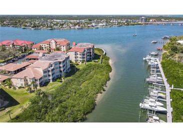 Waterfront condos overlooking a serene harbor, offering deep water access and stunning views at 434 Bouchelle Dr # 202, New Smyrna Beach, FL 32169