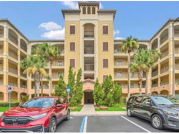 Attractive condo building showcasing a well-maintained exterior with colorful paint and ample parking at 8763 Worldquest Blvd # 5103, Orlando, FL 32821