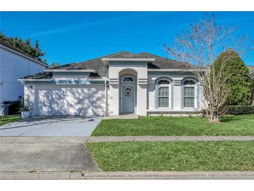 Charming single-story home with well-maintained lawn and blue trim, enhancing its curb appeal at 1817 Snaresbrook Way, Orlando, FL 32837