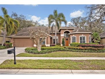 Charming single-Gathering home featuring a well-manicured lawn and mature landscaping at 2954 Willow Bay Ter, Casselberry, FL 32707