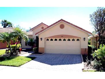 Charming single-story home featuring a tile roof and well-maintained landscaping at 603 Russ Pond Dr, Kissimmee, FL 34759