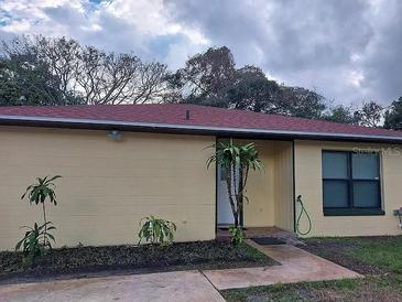 Charming single-story home with a well-maintained lawn and mature trees at 7520 Marietta St, Orlando, FL 32807