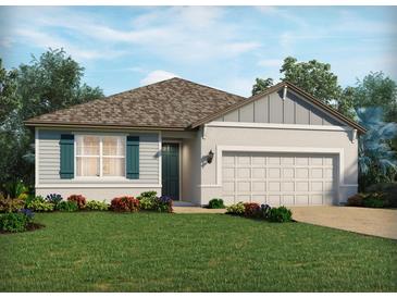 Charming single-story home with a well-manicured lawn and colorful landscaping enhancing its curb appeal at 3136 Legends Preserve Dr, Daytona Beach, FL 32124