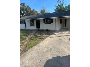 Charming single-story home with a freshly painted exterior and a concrete driveway at 211 Cadillac Ct, Altamonte Springs, FL 32701