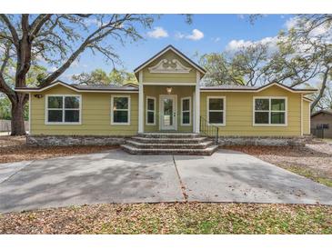 Charming single-story home featuring a welcoming entrance and well-manicured front yard at 2204 Votaw Rd, Apopka, FL 32703