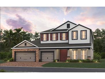 Charming two-story home with stone accents, three-car garage, and a welcoming front entrance at 2430 Francisco Art Ct, Oviedo, FL 32765