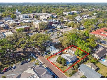 Aerial view of property showing its location within a vibrant neighborhood near local amenities and green spaces at 100 N Main St, Winter Garden, FL 34787