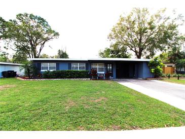 Charming one-story home with a well-maintained lawn and covered parking at 904 Crestwood Ln, Altamonte Springs, FL 32701
