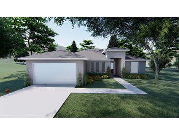 Charming single-story home with a manicured lawn, a two-car garage, and inviting curb appeal at 30369 Apricot Ave, Eustis, FL 32736