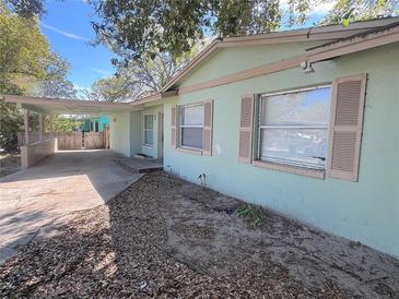 Charming single-story home with light blue exterior and shutters at 4220 Solomon Dr, Orlando, FL 32811