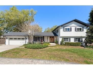 Charming two-story home with landscaped front yard and a classic white and black exterior at 315 E 6Th Ave, Windermere, FL 34786