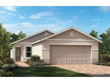 Charming one-story home featuring a two-car garage, neutral color palette and meticulously landscaped front yard at 3340 Rolling Hills Cir, Clermont, FL 34714