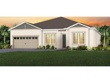 Charming single-Gathering home showcasing a neatly landscaped front yard and an attached two-car garage at 15343 Rising View Dr, Montverde, FL 34756