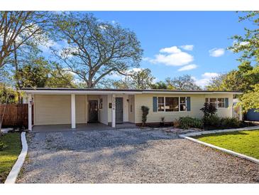 Charming single story home featuring a gravel driveway, covered entryway, and well maintained lawn at 3006 Northwood Blvd, Winter Park, FL 32789