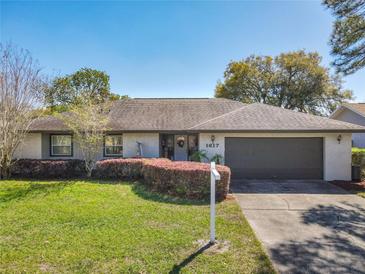 Charming single-story home with a well-maintained lawn and inviting curb appeal at 1617 E Sandpiper Trl, Casselberry, FL 32707